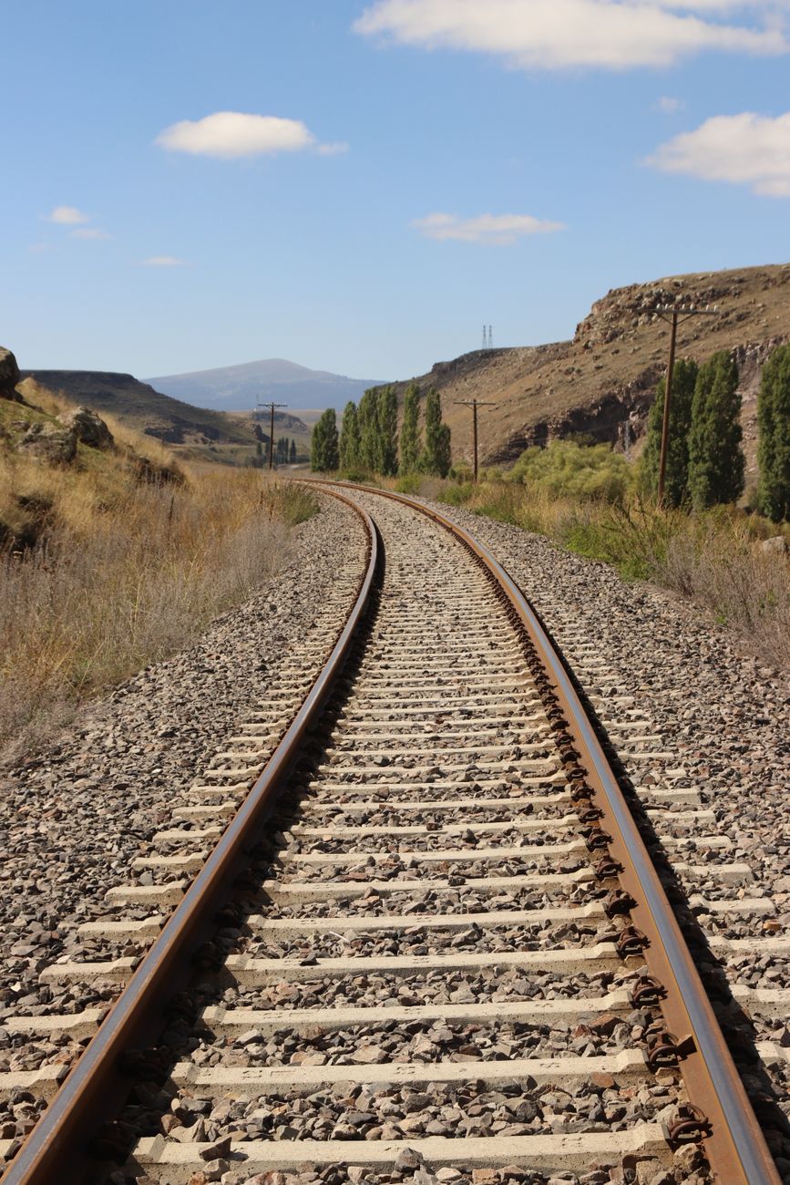 tranquil railway track in mountain landscape